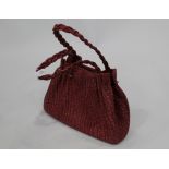 Pink grained buffalo leather handbag with plaited handles,