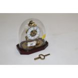 Miniature French "Du Chateau" skeleton mantle clock with plastic dome,