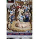 Box of festive Jim Shore handmade angel ornaments and Baby Jesus ornament