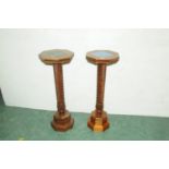 Pair of mahogany torcheres with tiled tops