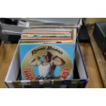 Box of records, including The Beatles Abbey Road, Top of the pops albums, Chitty chitty bang bang,