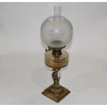 Brass oil lamp with etched glass shade and chimney,