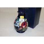 Boxed early 20th century Moorcroft vase, height 15.