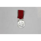 German War Merit medal inscribed to the back "Deutsche Berdient Medaille",