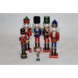 Six hand crafted wooden festive nutcrackers,