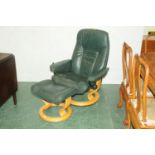 Ekornes green leather reclining chair and footstool