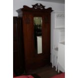 An Edwardian mahogany mirror door wardrobe, bearing label to interior manufactured by CWS,