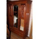 An Edwardian mahogany mirror door wardrobe,