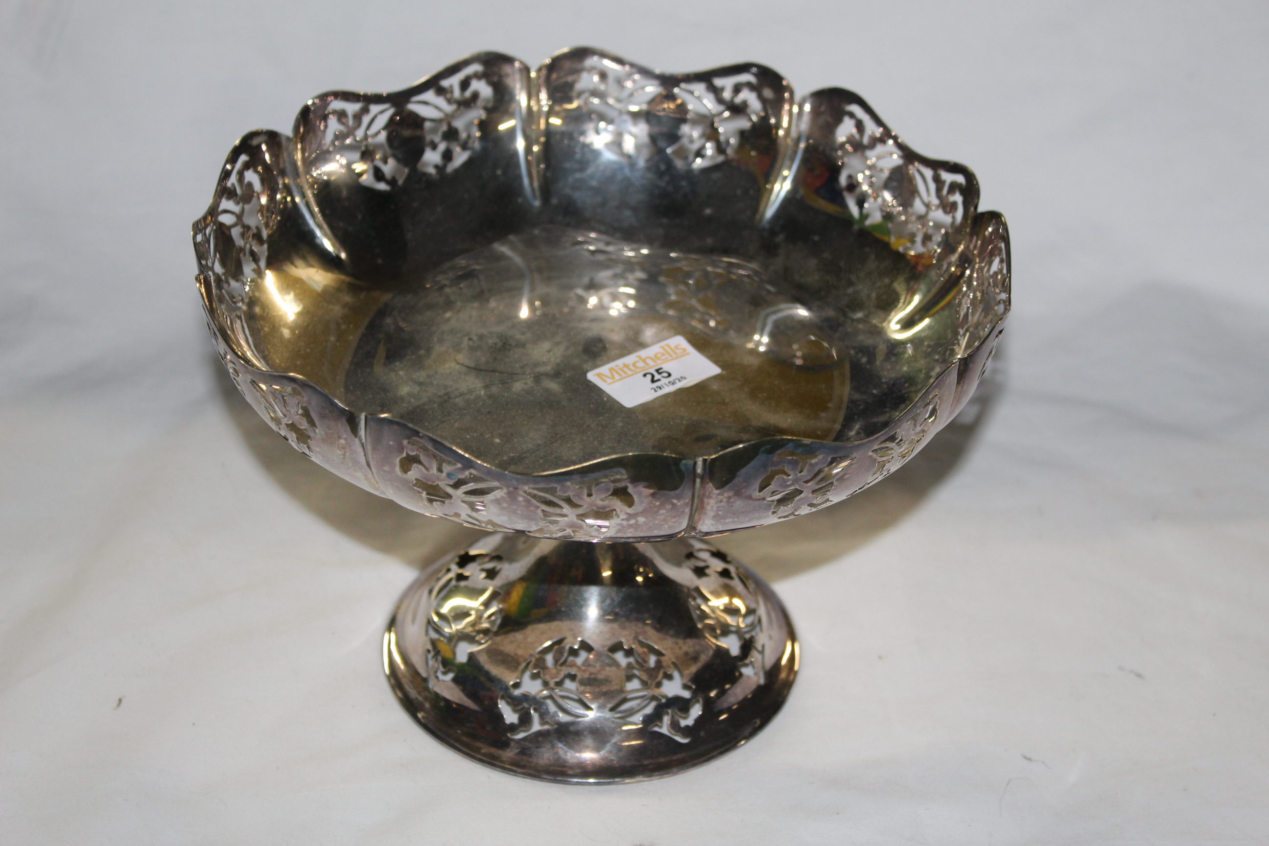 An early 20th century silver plated circular footed fruit bowl with pierced rim,