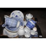 A quantity of blue and white pottery, mostly 19th century including a Copeland Spode's Italian jug.