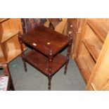 A 19th century mahogany 2 tier occasional table having a rectangular top and under tier uniting