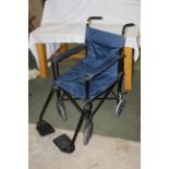 A modern positive momentum folding mobility aid / wheelchair.