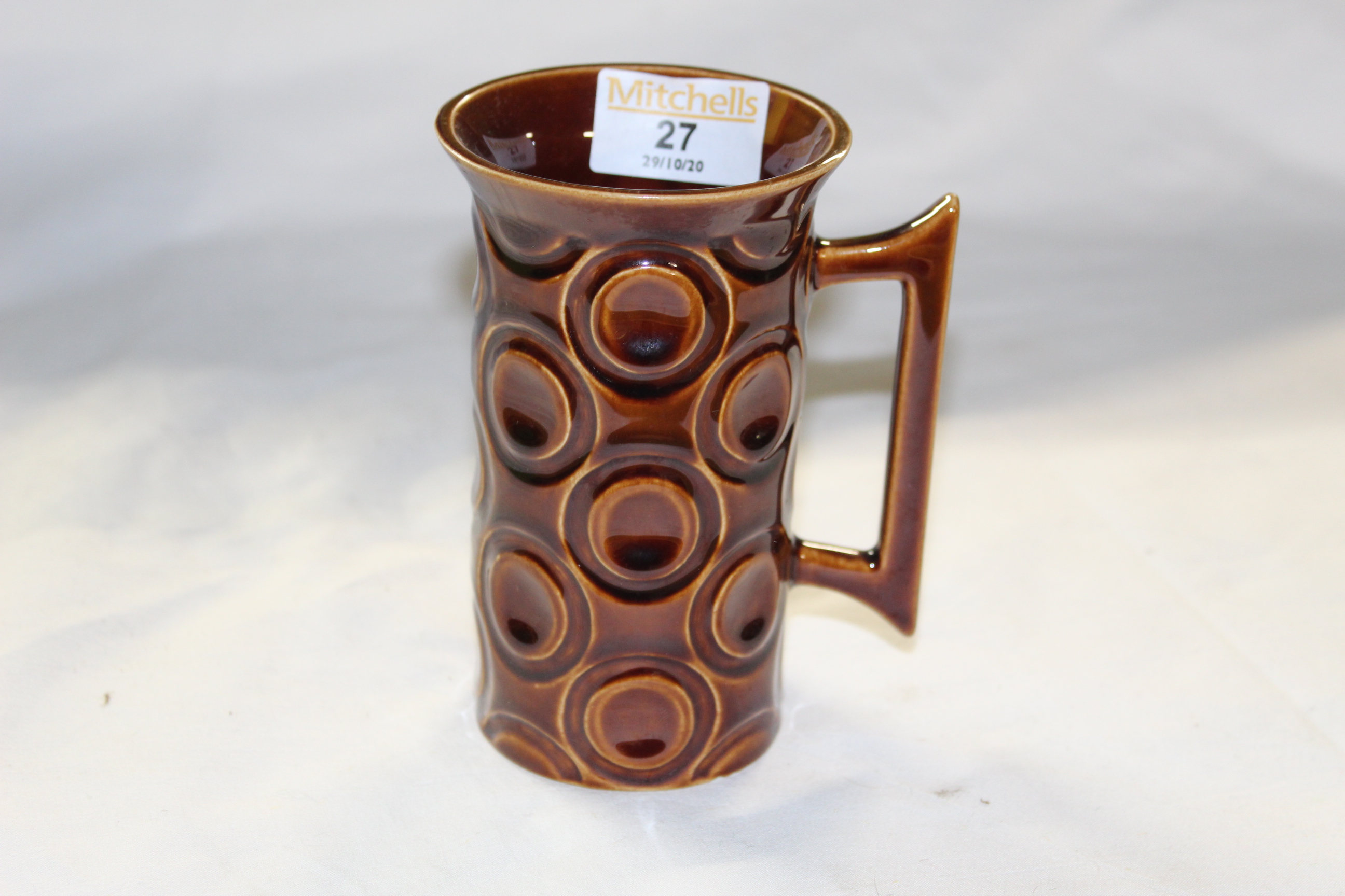 A Portmeirion "Jupiter" brown glazed pottery tall cylindrical mug with flared rim,