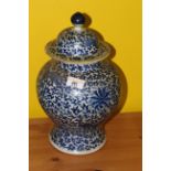 A late 18th/early 19th century Chinese blue and white baluster vase and cover,