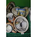 A group of Continental pottery jugs and platters.