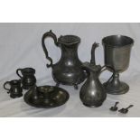 A group of miscellaneous 19th century pewter wares, including a chamber stick, chalice, coffee pot,