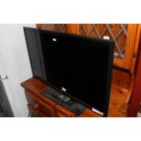 A Logik 31" TV with remote. CONDITION REPORT: This TV is in full working order.