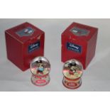 Two Enesco resin "Disney tradition" glitter globes modelled by Jim Shore - "I heart you" and "The