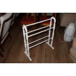 A white painted pine towel rail of traditional form, 81 x 69 cm.