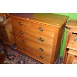 A late Victorian satin wood chest of drawers,