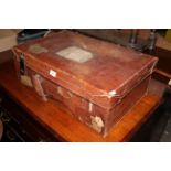 An early 20th century brown leather suitcase, containing mixed paper ephemera,