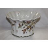 A modern Chinese planter or jardiniere of flared and fluted oval form decorated with birds amongst