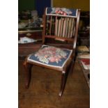 A 19th century inlaid mahogany bedroom chair with later padded upholstered top rail above stringing