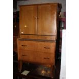 A mid century teak dressing table/cabinet by Wrighton, upper part fitted,