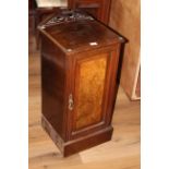 A late Victorian mahogany and walnut pot cupboard,