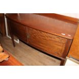 A 1920's figured mahogany bow front wash stand by Waring & Gillow,