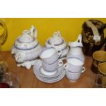 A Victorian Puce transfer printed pottery tea service,