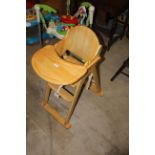 A child's light wood high chair, 105 cm high and a beech wood laminate side chair.