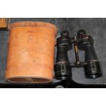 A pair of early 20th century black lacquered metal binoculars,