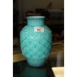 A Beswick Celadon glazed bulbous vase, moulded with repeating floral diaper pattern, 19 cm high.