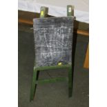 A vintage green painted child's easel chalk board, 93 cm high.