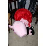 An adult size Peppa Pig dress up costume with foam head, fleece body and oversize black shoes.