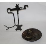 A pair of 19th century cast and a wrought iron beam scales with a selection of brass and cast iron