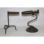Two 19th century goffering iron stands, one with moulded circular base and serpentine support,