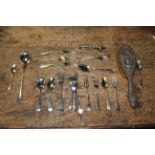 A small selection of silver plated flatware to include a silver backed brush.