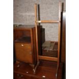 A 1930's oak cheval mirror and a pair of 1940's figured walnut bedside chests.