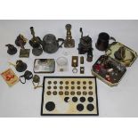 A display of graduating brass and cast iron weights, a William Cottom coffee grinder,