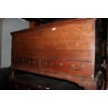 An 18th century oak mule chest, fitted two drawers on bracket feet,