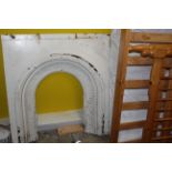 A Victorian white painted cast iron fire surround,