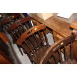 Set of six stained beech wood bistro chairs, the crest rails with handle cut outs,