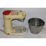 A vintage enamelled metal Kenwood Chef model A700D, sold along with stainless attachments.
