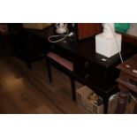A Stag Minstrel dressing table with triple mirror above the moulded oblong top and over drawers and