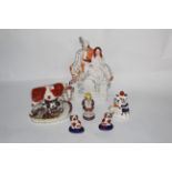 Three 19th century Staffordshire pottery figures,