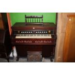 A late 19th century mahogany pedal organ, by Allmendinger, 115 cm wide.