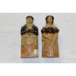 A pair of early 19th century brown two tone stone ware figural flasks,