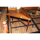 A 1960's triangular hardwood occasional table,